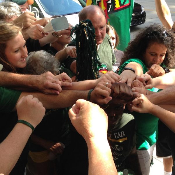 https://archive.wbhm.org/wp-content/uploads/2015/06/Football-Hands-Web-600x600.jpg