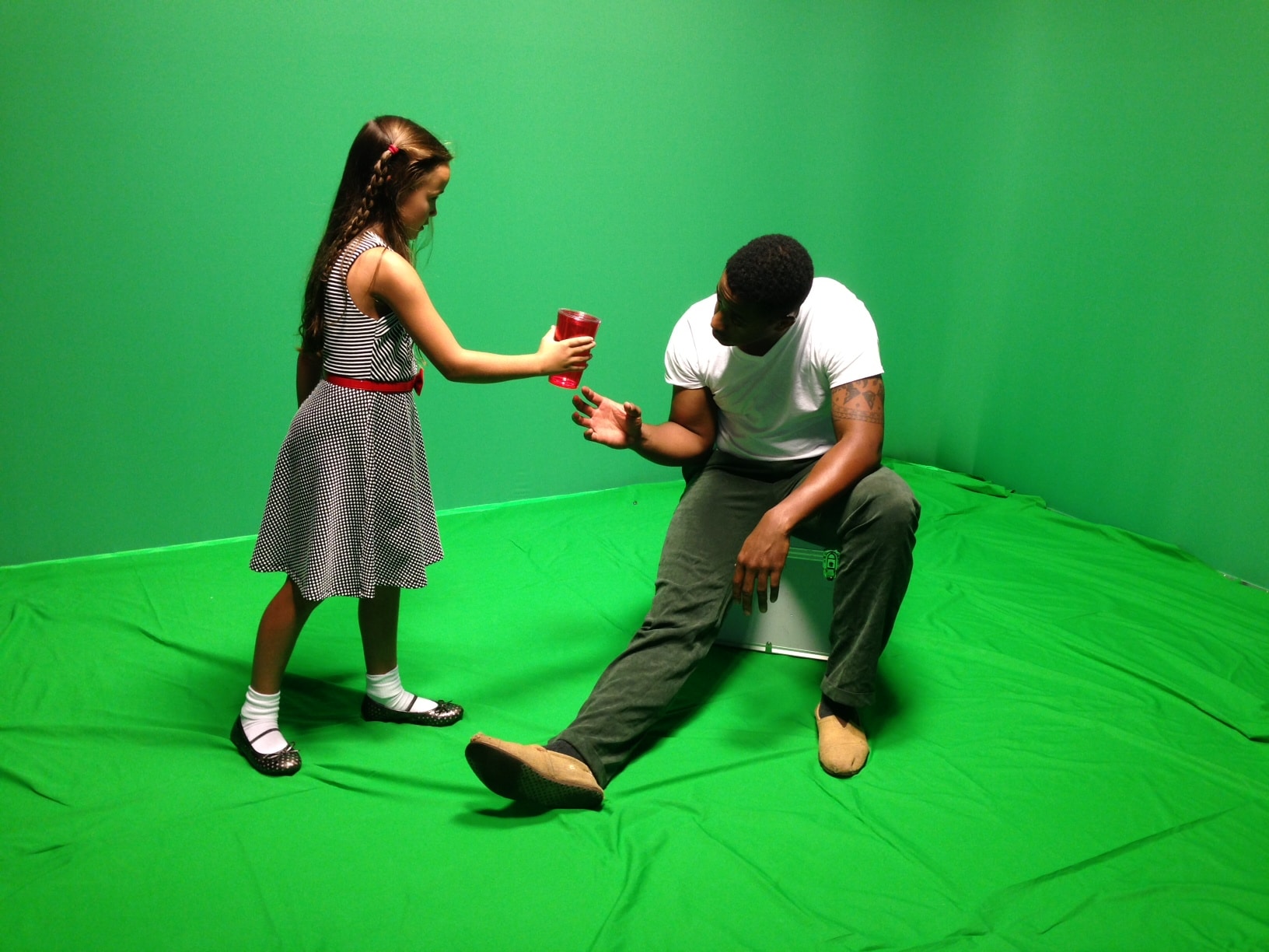 Actors pose for a future statue portraying Janie Forsyth McKinney given beaten Freedom Rider Hank Thomas a glass of water.