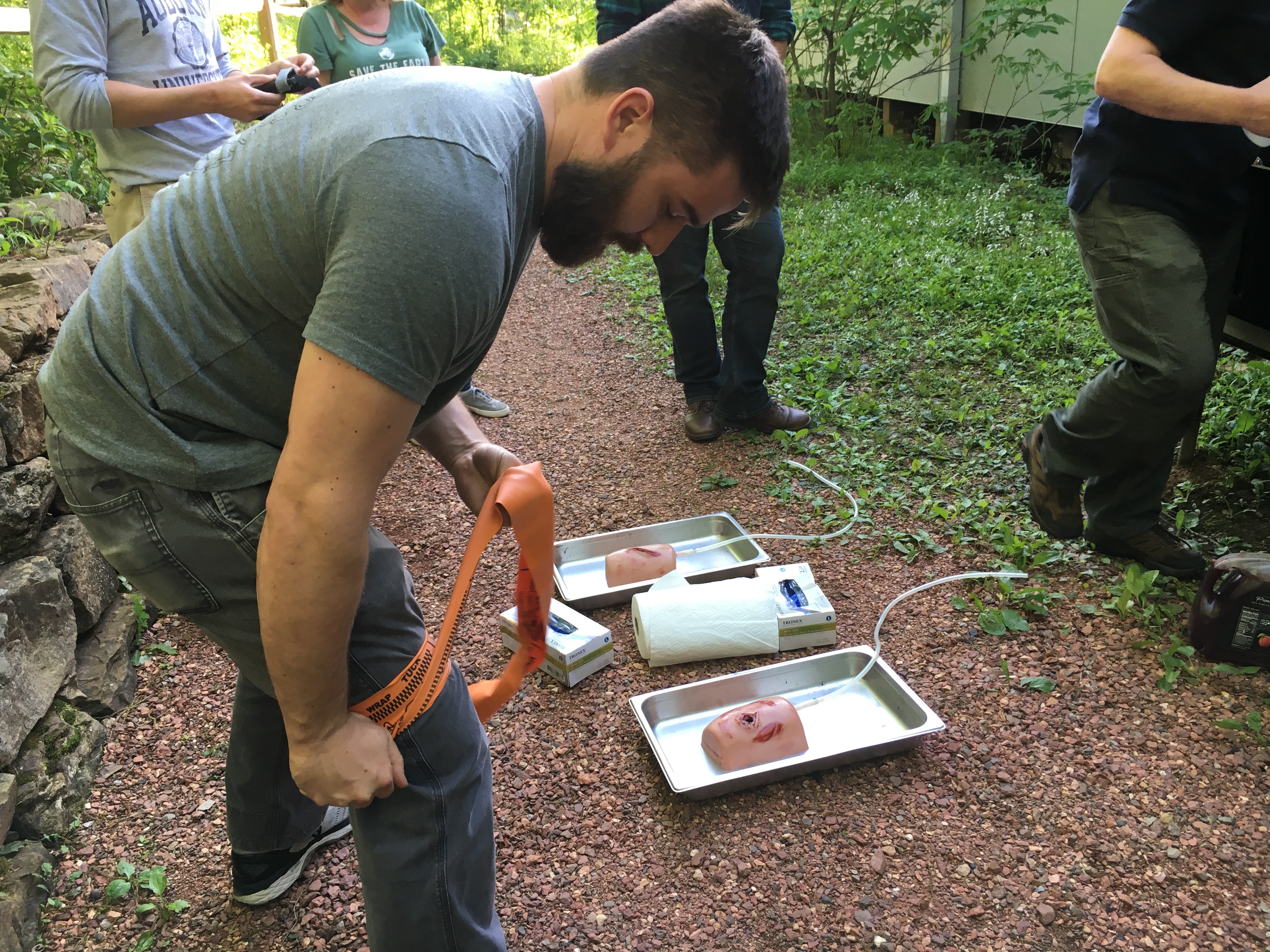 Huntsville first responder Stephen Gaffin practices using a tourniquet on his own leg. 