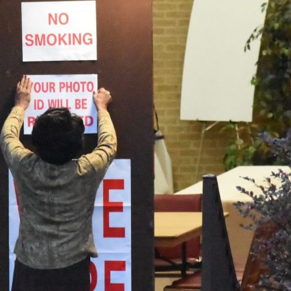 https://archive.wbhm.org/wp-content/uploads/2018/11/Poll-worker-puts-up-signs-at-Sixth-Avenue-Baptist-Church-polling-place-1024x635-e1541528287269-600x600.jpg