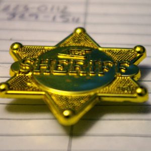 https://archive.wbhm.org/wp-content/uploads/2020/05/Sheriff_Badge-300x300.jpg