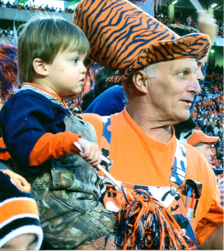 Fred Bishoff with his grandson at an Auburn University football game