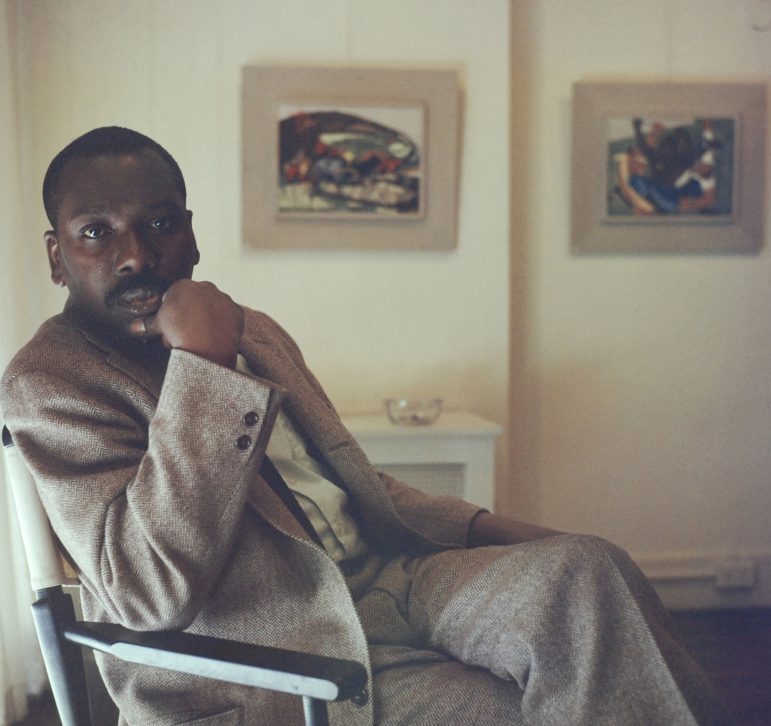 Artist Jacob Lawrence with panels 26 and 27 from Struggle: From the History of the American People