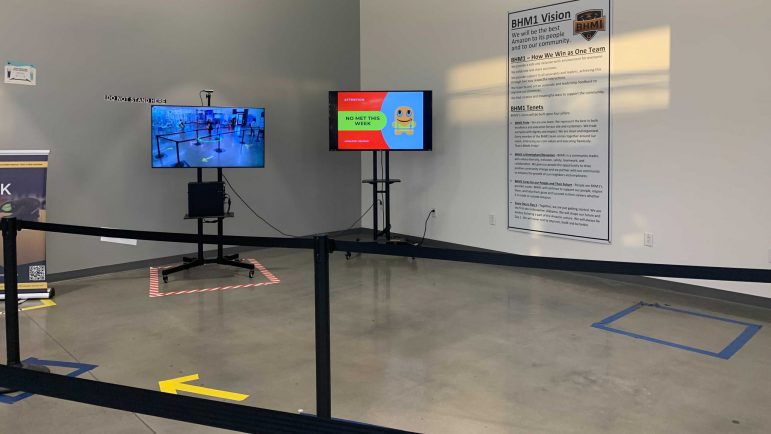 Amazon's digital monitoring tool dubbed “Distance Assistant." The camera designates green circles around individuals who are six feet apart. This tool is found in highly trafficked areas of the Amazon Bessemer facility.