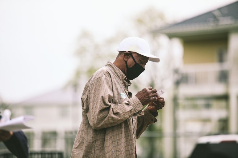 Employees from Westbank Fishing and Daybrook Fisheries gather at a mass vaccination clinic within Buras Auditorium in Plaquemines Parish, La., March 15, 2021.