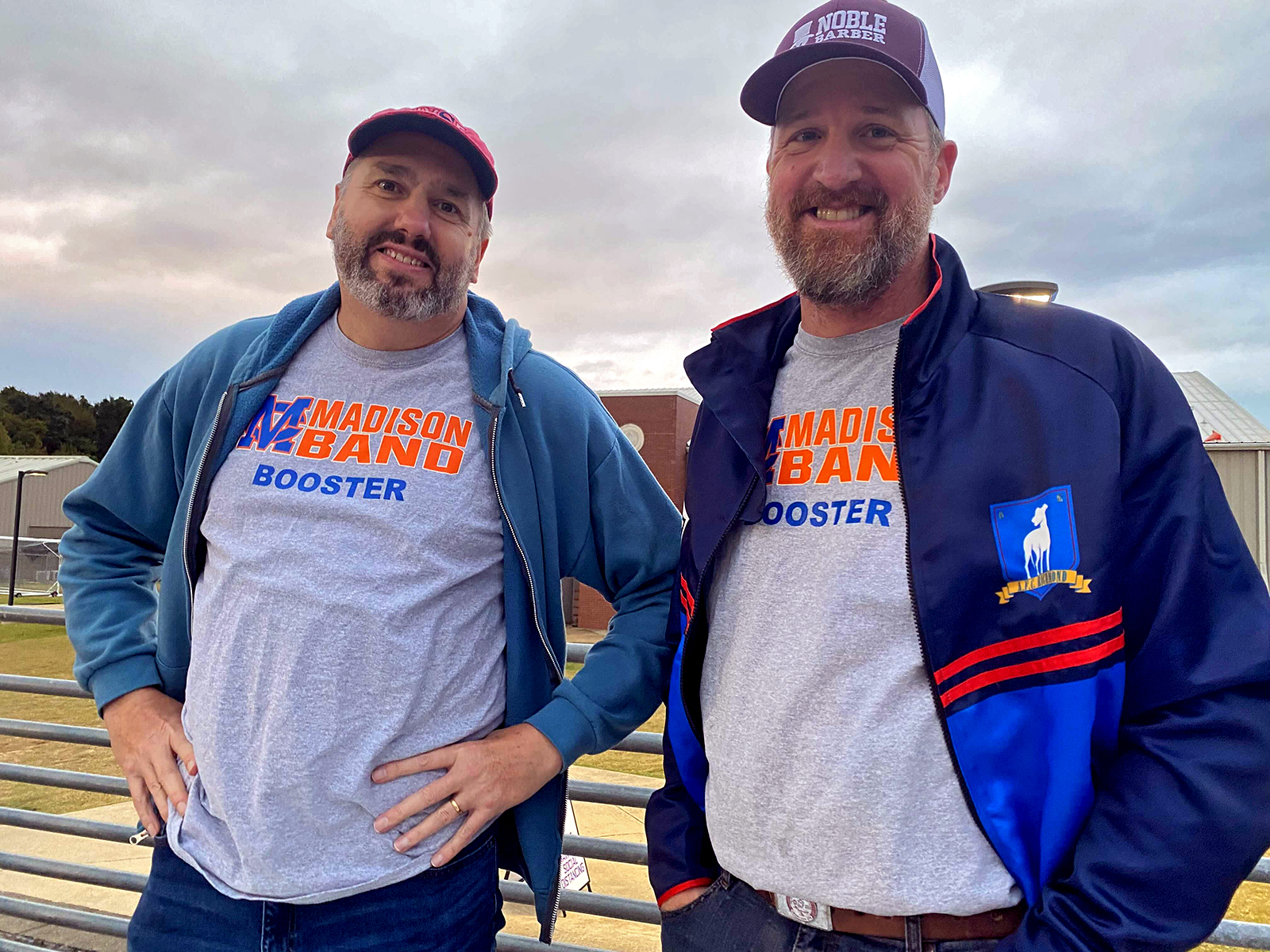 Madison Central parents Bryan Clements and Ken Ball pose for a picture before a football game against Murrah High School. Clements is standing on the left and Ball is standing on the right. Both men work in the medical field and got all their kids vaccinated, but believe school COVID vaccine mandates are not necessary.