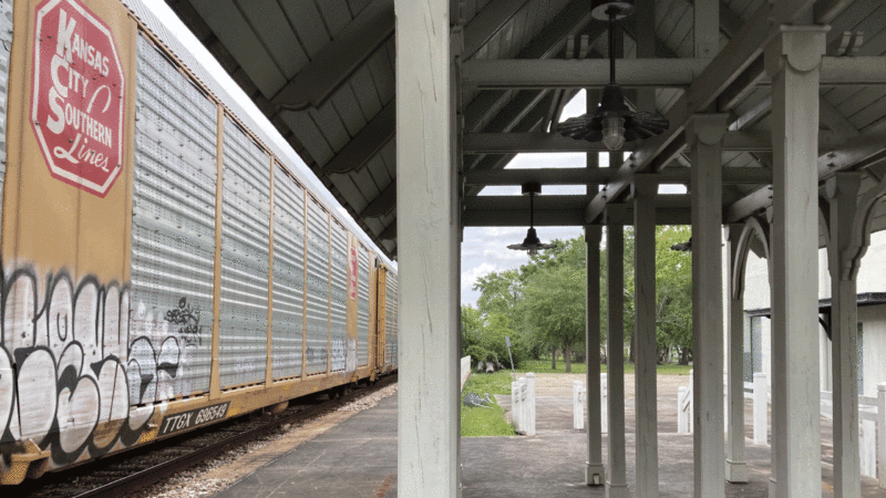 A freight train passes through Bay St. Louis, Mississippi.