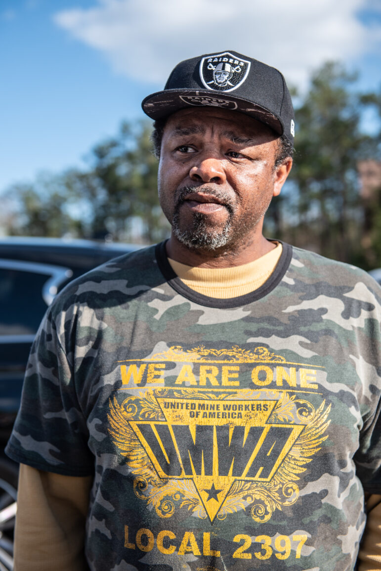 Johnny Murphy stands in the crowd at a union rally in Brookwood, Alabama.
