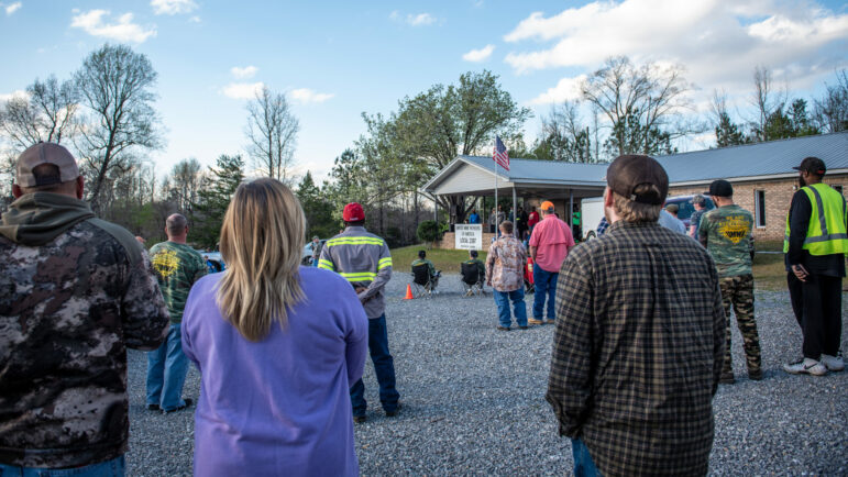 Striking coal miners listen at a union rally in Brookwood, Alabama.