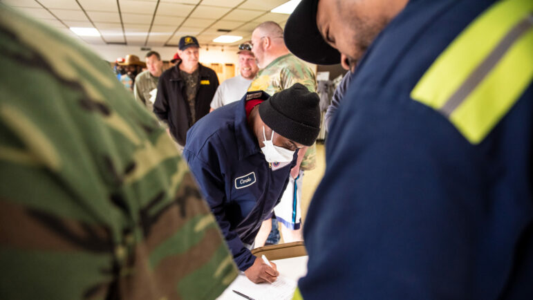 Coal miners on strike stand in line to pick up their strike checks in Brookwood, Alabama.