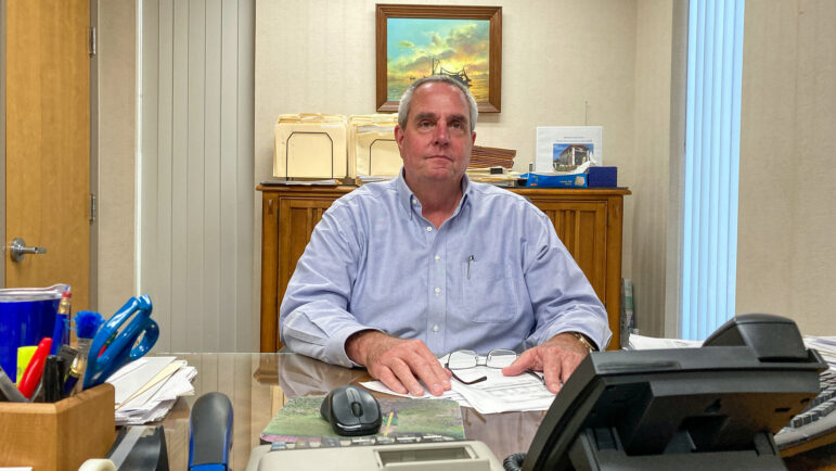 Coast Transit Authority’s Executive Director Kevin Coggin sits at his desk.