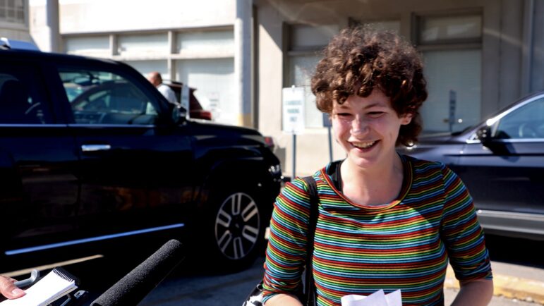 Billie Nyx smiles while talking to reporters following the Maple Street Starbucks’ successful unionization vote.