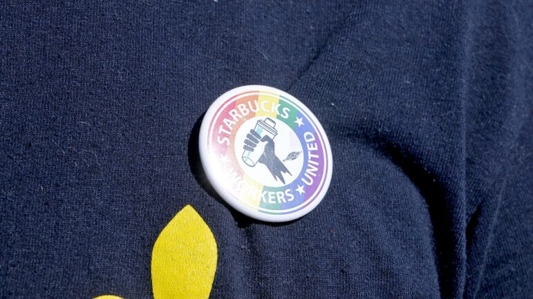 Paul Bissember wears a button on his t-shirt in support of the Starbucks Workers Union.