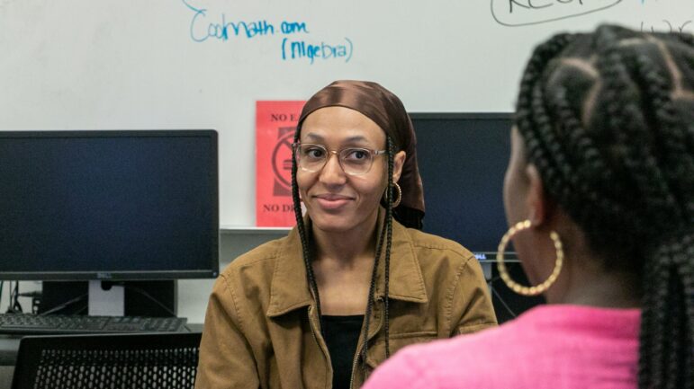 Victoria Bowden, In Her Hands’ engagement manager, talks to deputy director Renee Peterkin during an application drive at Albany Technical College in Cuthbert, Georgia.