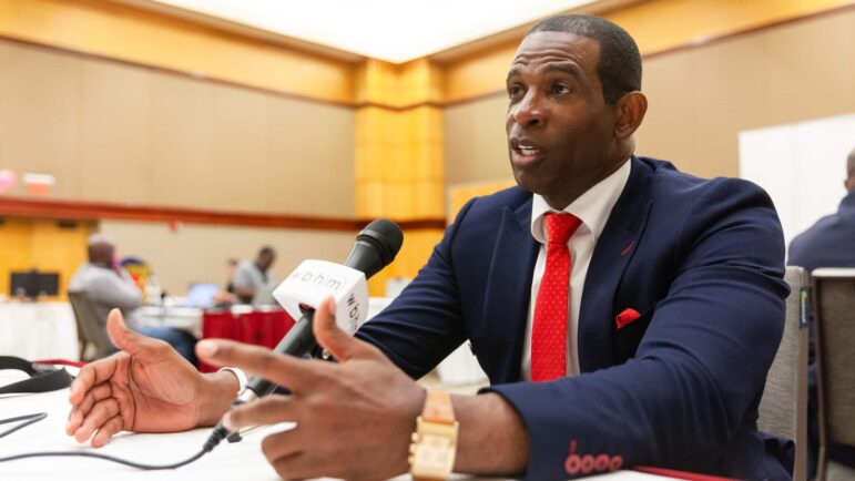 Jackson State University football coach Deion Sanders gives an interview during the Southwestern Athletic Conference’s media day event in Birmingham, Alabama, July 21, 2022.