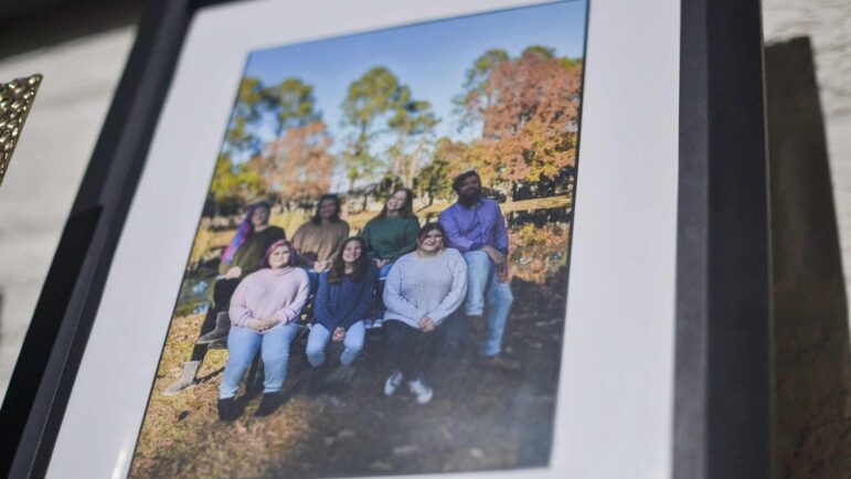Sadie Silverman, Kylie Silverman, and their siblings and parents are pictured in a family photo in their home in Clinton, Mississippi, Sept. 7, 2022.