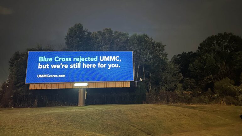 A billboard placed by UMMC in Jackson, Mississippi reads "Blue Cross rejected UMMC, but we're still here for you."