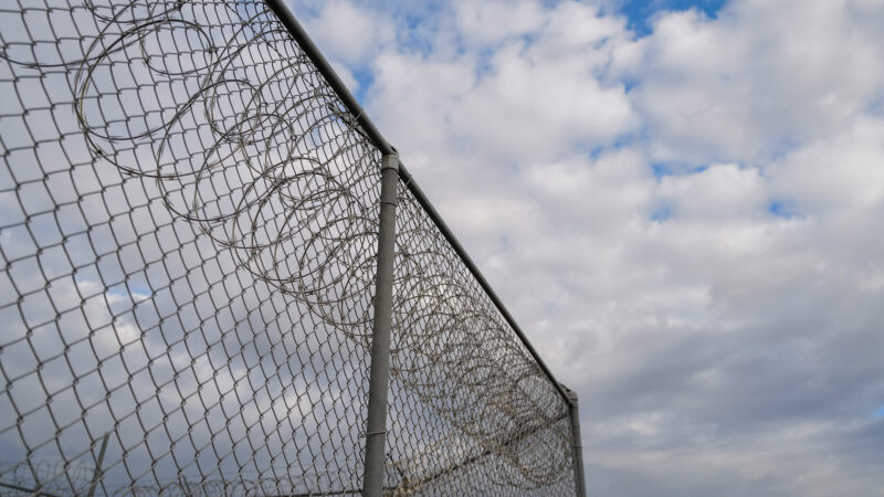 https://archive.wbhm.org/wp-content/uploads/2023/02/Prison_Barbed_Wire_Stock_Photo-800x450.jpg