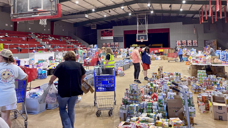 Volunteers in the Sharkey Issaquena Academy gym sort and gather items on March 27, 2023, for Rolling Fork, Mississippi, residents.
