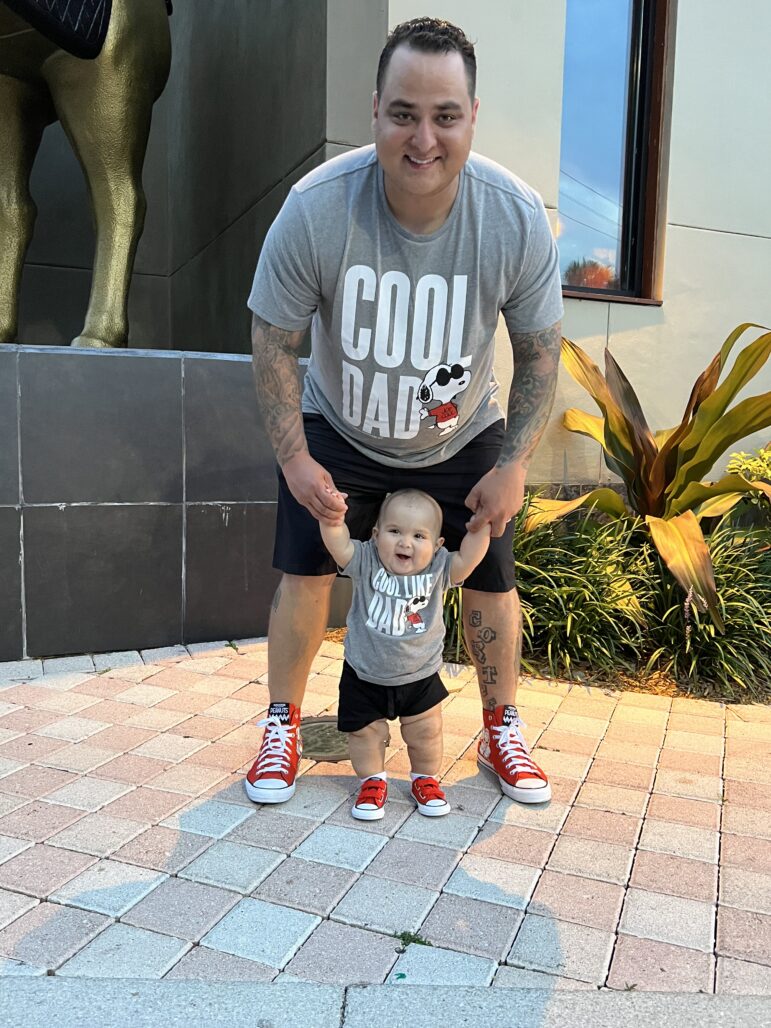 Daniel Cortes De La Valle poses with his son in this undated photo.