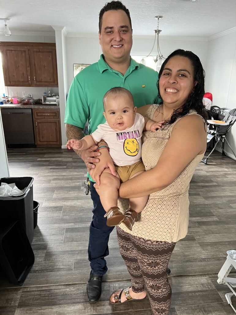 Daniel Cortes De La Valle poses with his wife, Alicia, and their son in this undated photo.