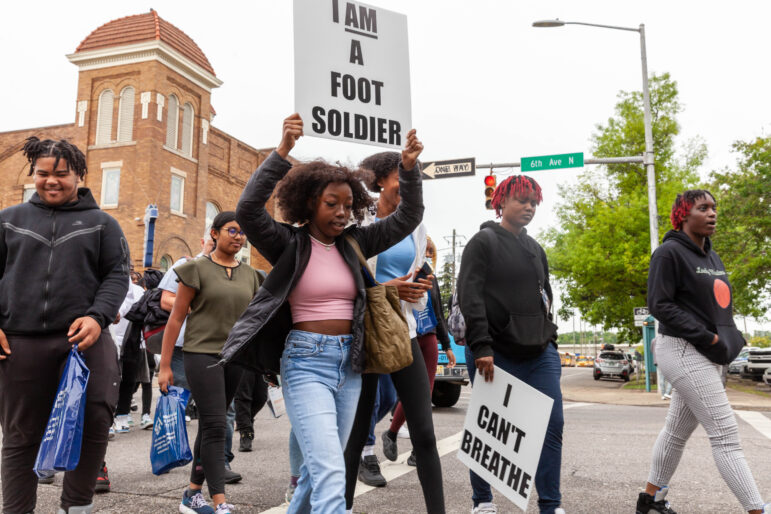 Children march with signs in downtown birmingham