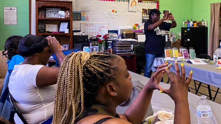 Chelesa Presley demonstrates cervical dilation during labor during the final class of Clarksdale Baby University's spring session in Clarksdale, Mississippi, on May 22, 2023.