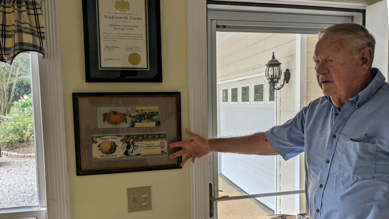 Mike Wadsworth points to the historic designation for his family’s farm in Cropwell, Alabama, on Monday, September 18, 2023.
