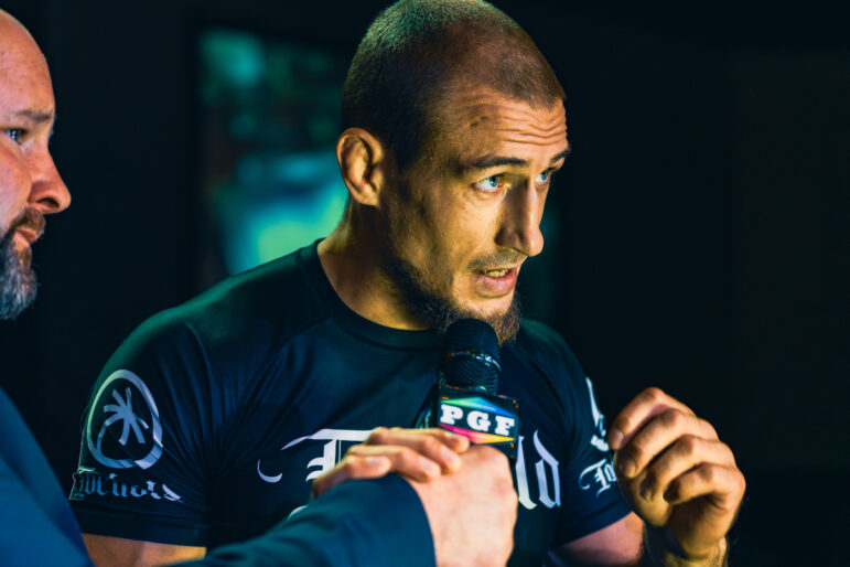 Fedor Nikolov speaks with Stephen Eakin after a match during the fourth day of the Professional Grappling Federation's fifth season at the BComing Church in Decatur, Alabama, on Nov. 2,2023.