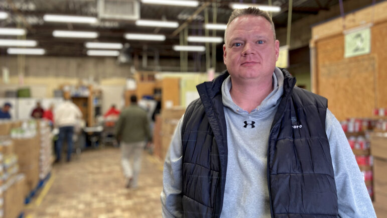Jason Martin, executive director of the St. Luke Food Pantry, stands inside the food pantry in Tupelo, Mississippi, on Nov. 30, 2023. Martin said the number of households the pantry serves has roughly doubled to 2,400 per month — compared to previous numbers from before the COVID-19 pandemic.