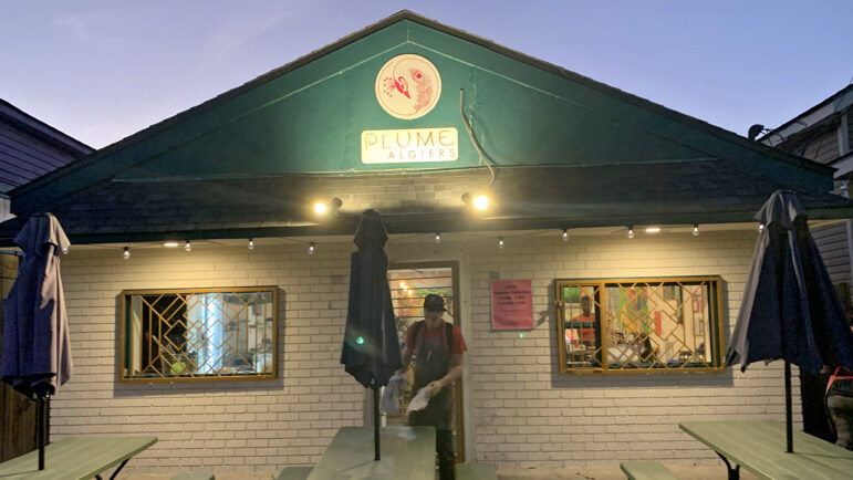 Tyler Stuart cleans up outside of Plume Algiers in New Orleans on November 18, 2023.