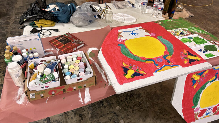 Krewe da Bhan Gras members put the final touches on the parade float during the group’s final dress rehearsal at the Caribbean Community Center in New Orleans on Wednesday, Jan. 24, 2024.