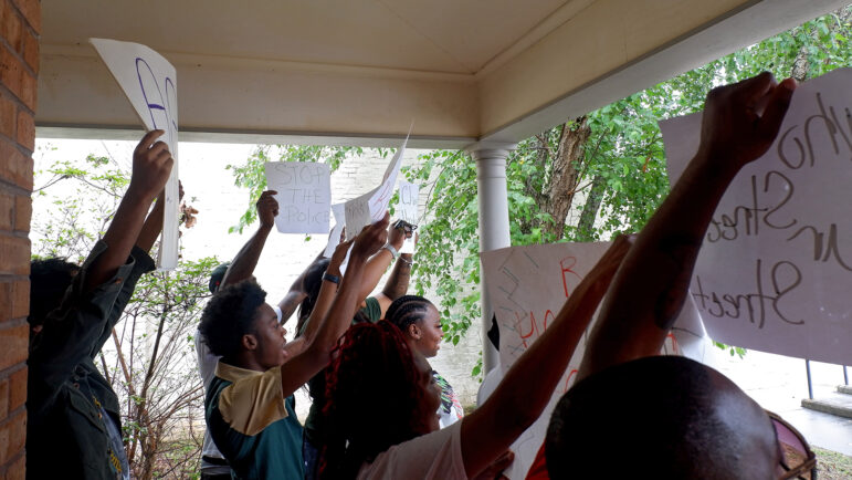 Lexington residents concerned with policing in their town protest outside of the courthouse and police station on July 18, 2023.