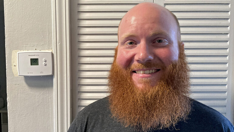 Will Burt stands in his apartment in downtown Birmingham, Alabama, on Feb. 13, 2024.