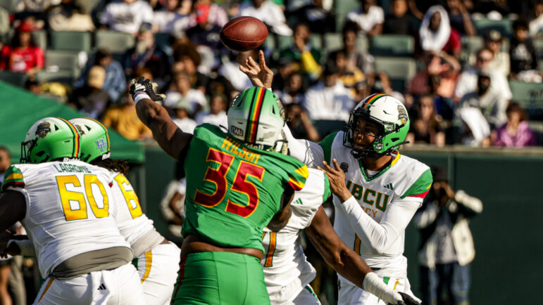 Team Robinson defensive end Jaren Wilson (35), of Edward Water University, rushes Team Gaither quarterback Quinton Williams, of Howard University, during the first half of the HBCU Legacy Bowl NCAA college football game, in New Orleans, Saturday, Feb. 24, 2024.