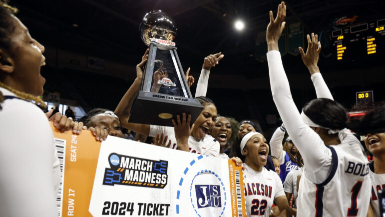 Jackson State guard Ti'lan Boler (1) reacts after punching the ticket as the team celebrates after their win over Alcorn State in an NCAA college basketball game in the championship of the Southwestern Athletic Conference tournament, Saturday, March 16, 2024, in Birmingham, Ala.