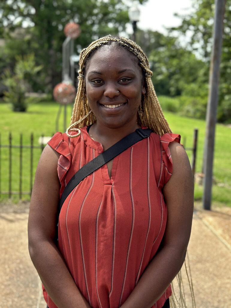 Valencia Metcalf, 26, poses for a portrait in downtown Clarksdale, Mississippi, on Sunday, May 12, 2024.