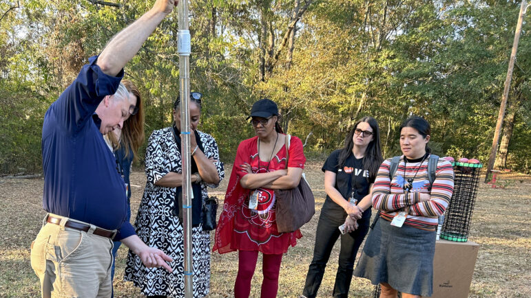 Stephen Moeller, of RioVation, shows a sample of sewage water to a group from California on Monday, October 28, 2024, in Tyler, Alabama.