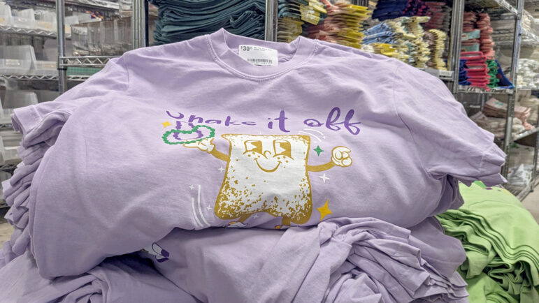 A stack of Taylor Swift-themed t-shirt sits in the Fleurty Girl warehouse in New Orleans on January, 20, 2025.