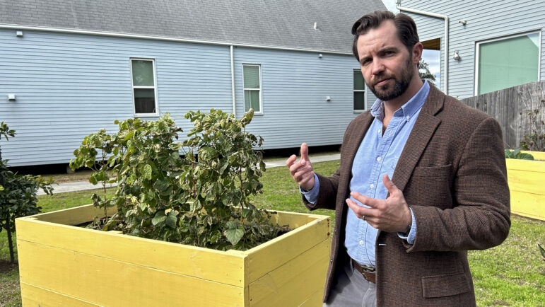 Jackson M. Smith stands near a raised garden bed at Bastion, a community for injured veterans in New Orleans, on Jan. 17, 2025.