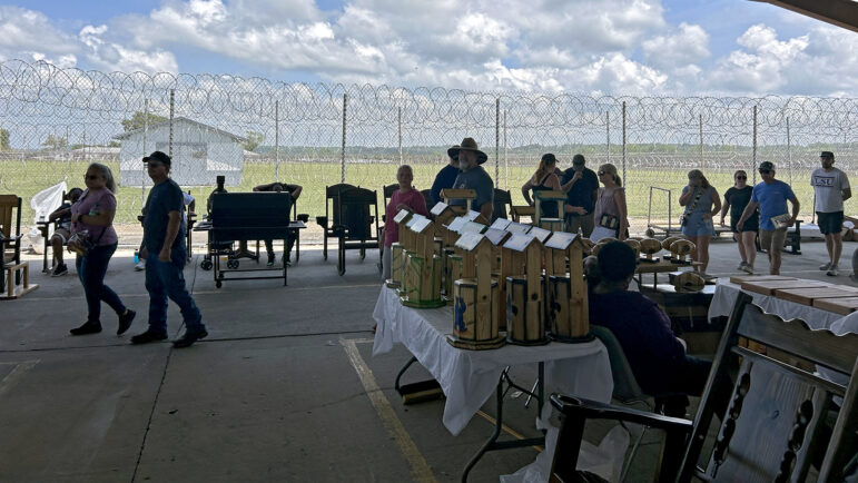 Visitors to the Angola Prison Rodeo look through handicrafts sold by the men incarcerated at Louisiana State Penitentiary in Angola, Louisiana, on Saturday, April 26, 2025.