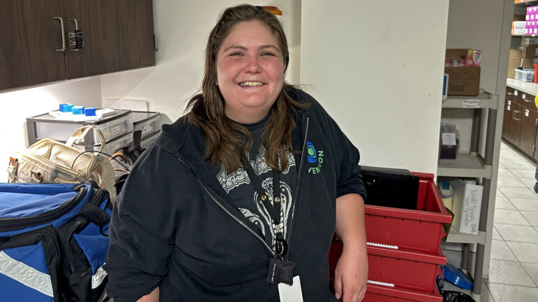 New Orleans Syringe Access Program's prevention manager Caitlin Boyle stands in front of items used NOSAP's the syringe exchange program.