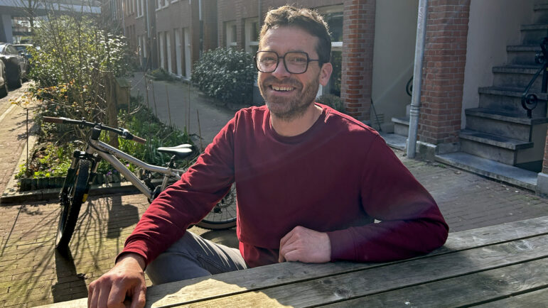 Has Cornelissen sits outside a cafe in Amsterdam on Monday, March 10, 2025.