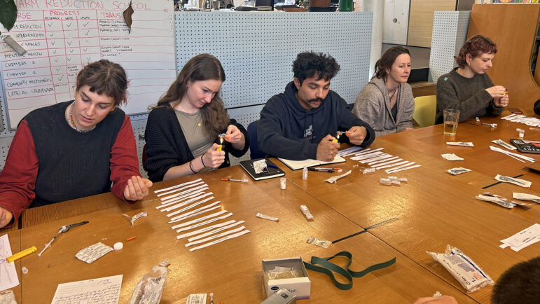 Mainline staff prepare syringes of “fake heroin” during a safe-injection training at the Mainline offices in Amsterdam on Thursday, March 6, 2025.