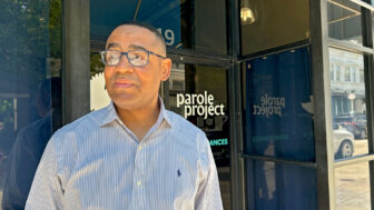 Ronald Olivier, a former "juvenile lifer," stands near the doors to the Louisiana Parole Project's offices in Baton Rouge on April 16, 2025.