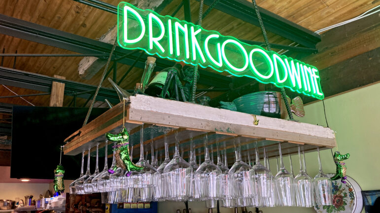 A neon sign hangs above the bar at The Little House in New Orleans on January 20, 2025.