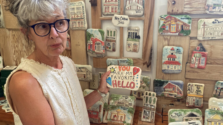 Jenis McCardell shows off ceramic pieces she makes and sells at Gallery 220 in Bay St. Louis, Mississippi, on Aug. 15, 2025.