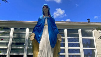 A statue of the Virgin Mary stands outside of Our Lady of Victories Catholic Church in Pascagoula, Mississippi, on Aug. 14, 2025.