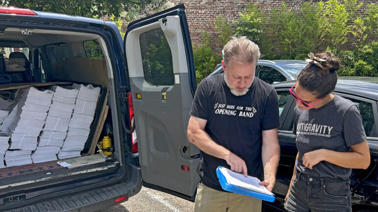 Antigravity editor-in-chief Dan Fox goes over the distribution routes and numbers with Antigravity staff in the New Orleans Food Co-Op parking lot on Tuesday, July 1, 2025.