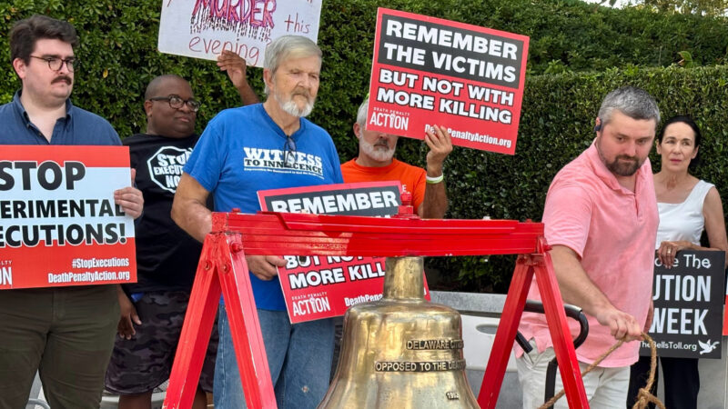 Will Berry rings a bell to symbolize opposition to the death penalty during a protest outside the Capitol in Montgomery, Ala., on Tuesday, Sept. 23,2025.